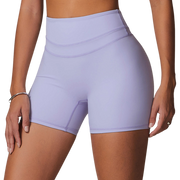 Person wearing white athletic shorts and top on a white background